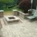 Stamped Concrete Patio With Square Fire Pit Imposing On Home In B T Klein S Landscaping Hardscapes Firepits 1